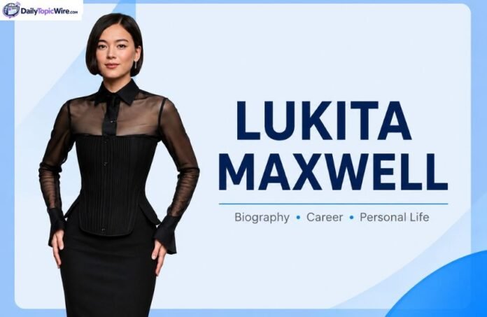 Lukita Maxwell standing in black dress with name text